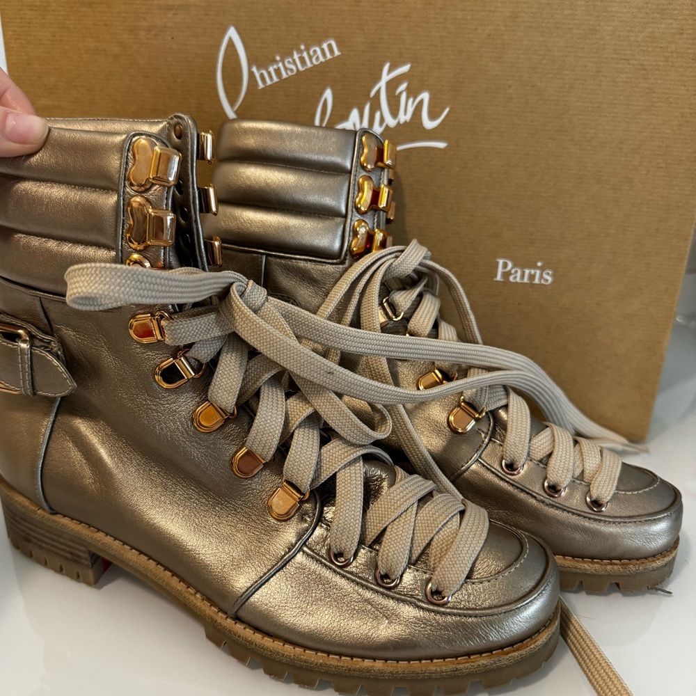 Christian Louboutin who runs colombe gold hiking boots